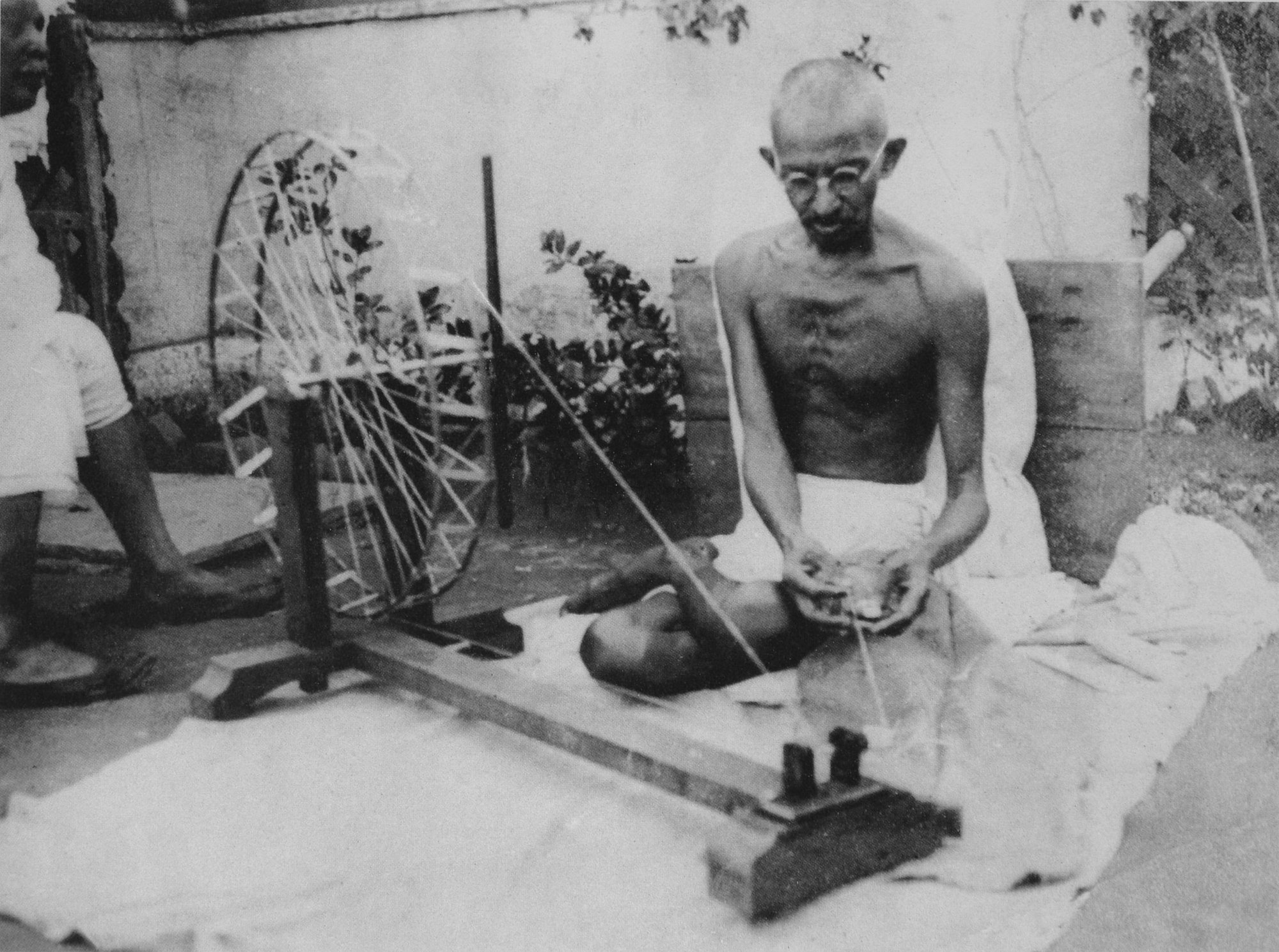 Mahatma Gandhi at his spinning wheel